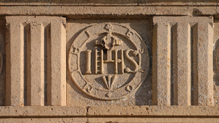 A stone-worked emblem of the Christian symbol for the name Jesus Christ
